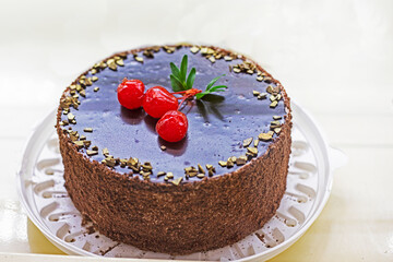 cake sprinkled with chocolate and cherries. Holiday party. Diet food.entrance to the supermarket through turnstiles