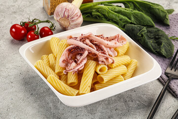 Italian cuisine - pasta tortiglioni with squid