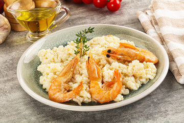 Italian risotto with prawn served thyme