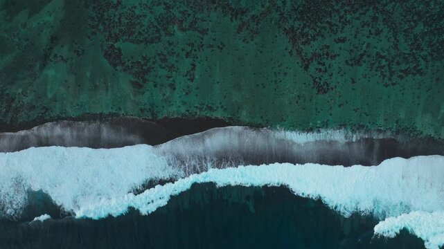 Stunning coral reef swell surf waves break aerial drone birds eye perspective view Passe Havae Faremahora crystal clear blue South Pacific Ocean Teahupoo Tahiti French Polynesia summer Paris Olympics