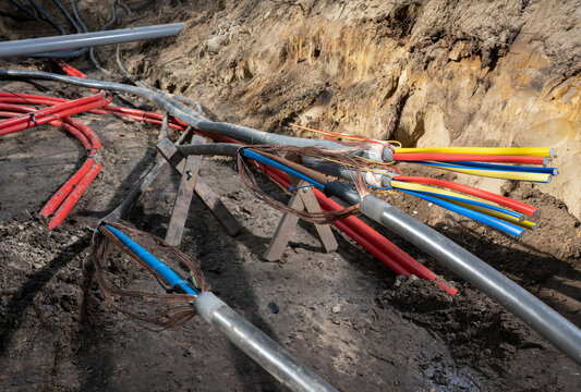 Multi colored underground power lines at construction site