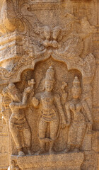 Carving sculpture of Hindu deities on a pillar of Veerabhadra Swamy Temple Mandapa, Lepakshi, Andhra Pradesh, India