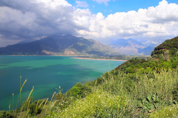 Aerial view of the Charvak reservoir, Tashkent region, Uzbekistan, Central asia. Top view on lake Charvak is a water reservoir in Bostanliq District, Czatkalski Rezerwat Biosfery