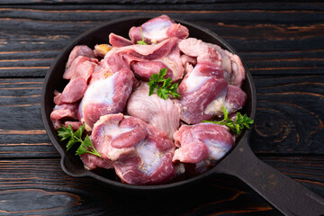 Raw chicken giblets gizzard ( stomach ) , meat background