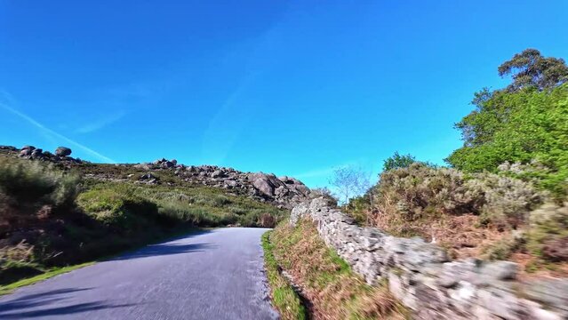 Driving with the car through the Peneda Geres National Park in Portugal, Europe. Area around Ponte da Barca