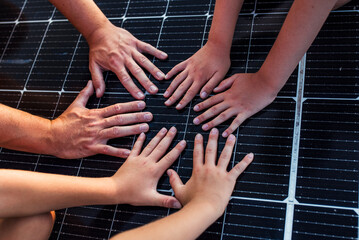 Hands on solar panel. Rooftop solar or photovoltaic system. Sustainable future for next generation.