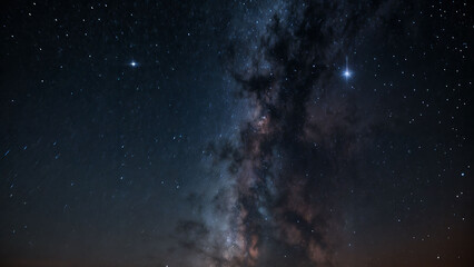 Fototapeta premium A night sky featuring the Milky Way and stars.