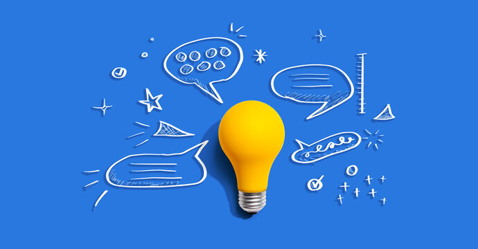 Brainstorming concept with a light bulb and speech bubbles - Flat lay