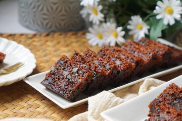 Kek Buah Kukus, a traditional Malaysian steamed fruit cake filled with dried fruits, nuts, and spices, enjoyed during celebrations.