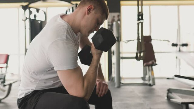 Passionate male fitness enthusiast dedicated to his physical training, pushing himself to new limits