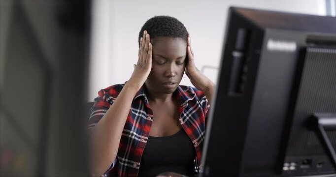 Frustrated businesswoman working tired on computer