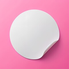 A realistic, round, white paper adhesive sticker mock-up on pink background