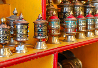 Small souvenir holy prayer wheels at gift store in Kathmandu