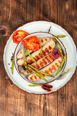 Grilled sausages on plate