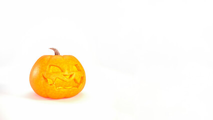 Halloween pumpkin smiles on white background with copy space. Jack o lantern on Halloween background