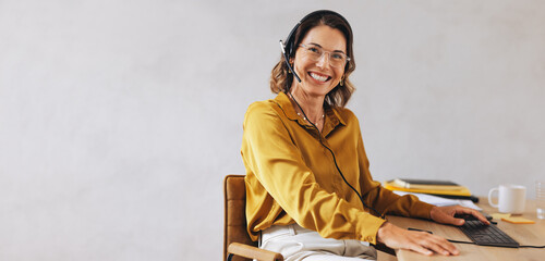 Female call center agent providing customer support in a telecommunications office