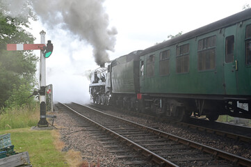 Battle of Britain class locomotive puffing away from the station. 