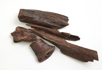 A closeup of agarwood sticks on white background