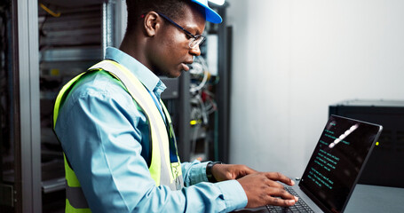 Man, maintenance and server room or coding with laptop, electrician and firmware update installation or system programming. Network, database and IT technician typing, bigdata and software technology