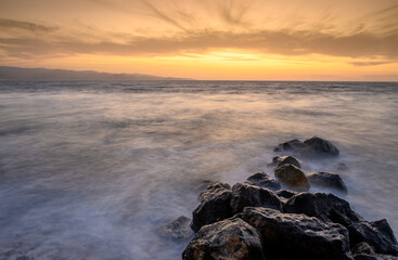 long exposure waves at sunset on the sea