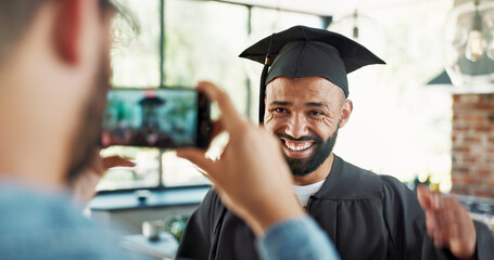 Fototapeta premium Graduation, student and excited with photo in home for certificate, diploma and success in education. Man, picture and memory for social media post, scholarship and celebration for study achievement