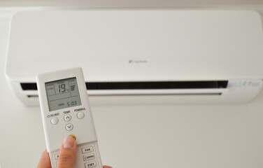 A wall-mounted air conditioner device paired with a remote control provides efficient cooling for...