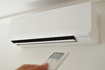 A wall-mounted air conditioner device paired with a remote control provides efficient cooling for...