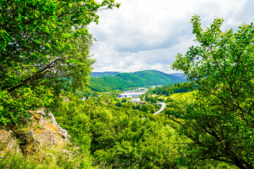 View from the Oestrich castle hill near Iserlohn. Landscape with green nature and mountains.
