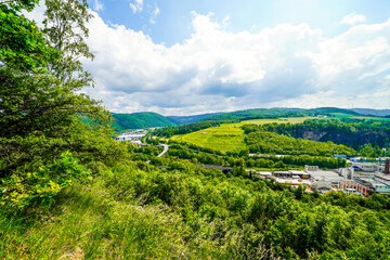 View from the Oestrich castle hill near Iserlohn. Landscape with green nature and mountains.
