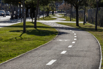 A road with a bike lane and a sidewalk