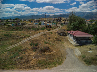 Fototapeta premium One-storey earthen houses by the lake