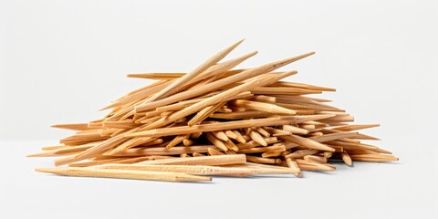 A pile of wooden sticks sitting on a table, great for various uses such as crafting or decoration
