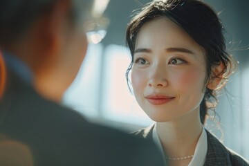 Portrait half-body of a Japanese entrepreneur meeting with a branding expert in a bright studio, hyper-realistic, high detail, photorealistic