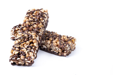 Healthy Muesli bars with nuts and black chocolate isolated on white background. Copy space