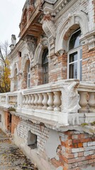 Obraz premium A white balustrade balcony with a large window, overlooking a residential building