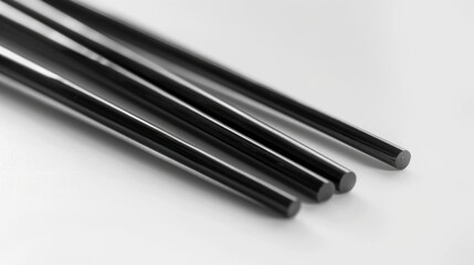 A collection of black metal rods arranged on a white background