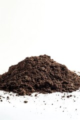 A small pile of dirt sits on top of a clean, white surface