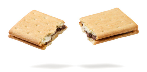 Cracker sandwich broken in half flying close-up on white. Isolated
