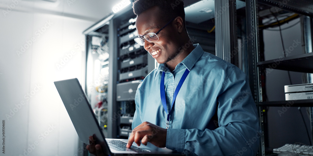 Poster Laptop, server room and black man on network for database maintenance, programming software or typing. Tech, data center and happy engineer on system for information, cybersecurity or cloud computing
