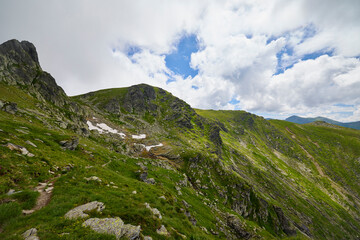Landscape with the Fagarasi mountains in Romania on a summer day.