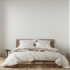 bed with pillows in front of empty wall