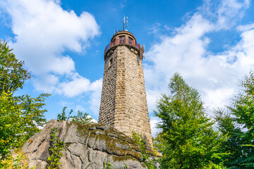 Rising against a blue sky, the stone lookout tower on Prosecsky Hreben in the Jizera Mountains...
