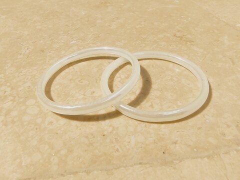 Set of two White marble isolated close up photograpy, Traditional wear female hand marble white silver bangles wedding female round rings collection bangles jewelry