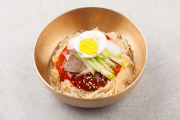  A food made by boiling ingredients such as onions and peppers, then pouring the cooled soy sauce over prepared crabs several times and allowing them to age.