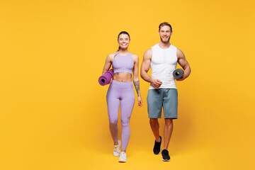 Full body young strong fitness trainer sporty two man woman wear blue clothes spend time in home...