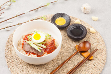  A food made by boiling ingredients such as onions and peppers, then pouring the cooled soy sauce over prepared crabs several times and allowing them to age.