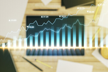 Multi exposure of abstract creative financial chart and digital tablet on background, top view, research and analytics concept