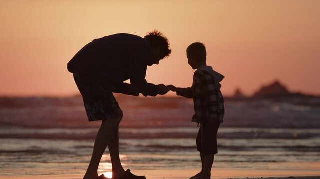 Precious memories of uncle and nephew beachcombing at sunset in Cornwall