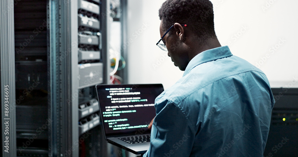 Fototapete Server room, black man or coding with laptop for system upgrade, cybersecurity or screen. Software management, data or male programmer with digital for problem solving, analytics or troubleshooting