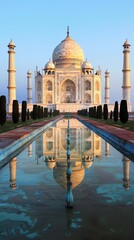 Fototapeta premium The Taj Mahal reflected in a pool of water in India